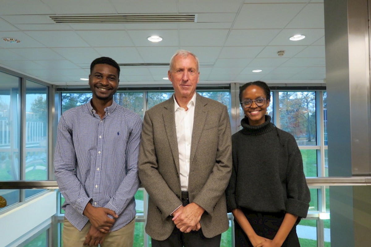 Image – David Suddens with scholarship students